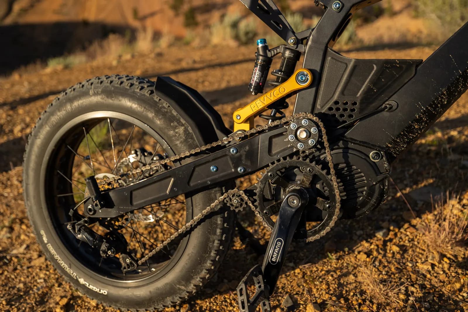 Close-up of the Surfline's drivetrain and full suspension in the desert